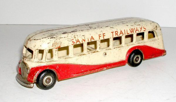 ARCADE SANTA FE TRAILWAYS BUS: ARCADE SANTA FE TRAILWAYS BUS circa 1937 - 9 ¾" long. Exceptionally RARE version of the Trailways bus. Finished in ivory with red trim. Nickeled radiator, lights, front bumper and rear panel. Black r
