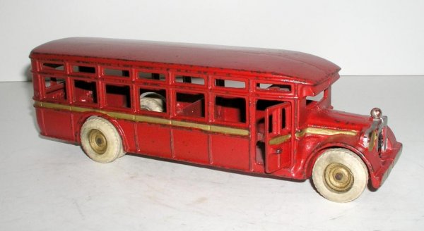 ARCADE ACF COACH: ARCADE ACF COACH circa 1927 - 11 ½" long. RARE bus in extra special condition. Side opening door. Bright red finish with gold accents and striping. White rubber wheels, rear duals, and gold centers.