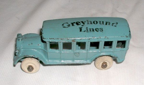 ARCADE "GREYHOUND LINES" BUS: ARCADE "GREYHOUND LINES" BUS circa 1930 - 5" long. Unusual small-sized private label bus advertising the Greyhound Bus Lines. Nice blue finish with black lettering-white rubber tires. Very minor edge