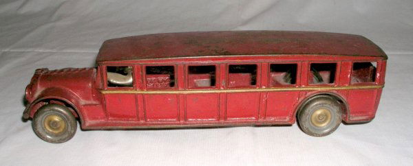 ARCADE FAGEOL SAFETY COACH: ARCADE FAGEOL SAFETY COACH circa 1925 - 12" long. Very sound and quality bus finished in red with gold body stripe. Dual rear wheels.- nickeled driver. Paint loss mostly on roof. (Exc cond) $400 - $60