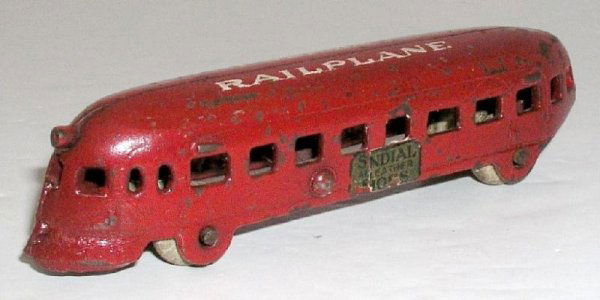 ARCADE ``PRIVATE LABEL`` PULLMAN RAILPLANE: circa 1936 – 5 1/8" long. Lovely railplane with extremely rare private label, advertising "Sundial Leather Shoes". This is a very important , unusual, and RARE example. (Exc cond)