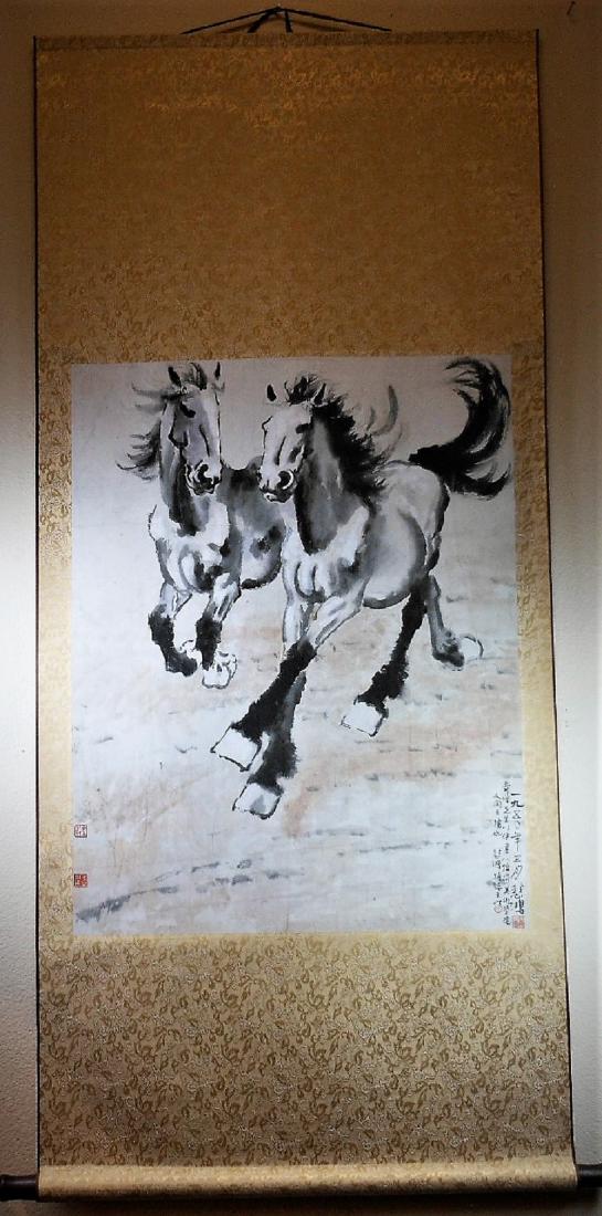 A Chinese color painting paper scroll: A Chinese color painting paper scroll, painted with two horses, [Xu Beihong] mark, 29x23 in (73.6x58.5 cm). 徐悲鴻款設色紙本奔馬圖