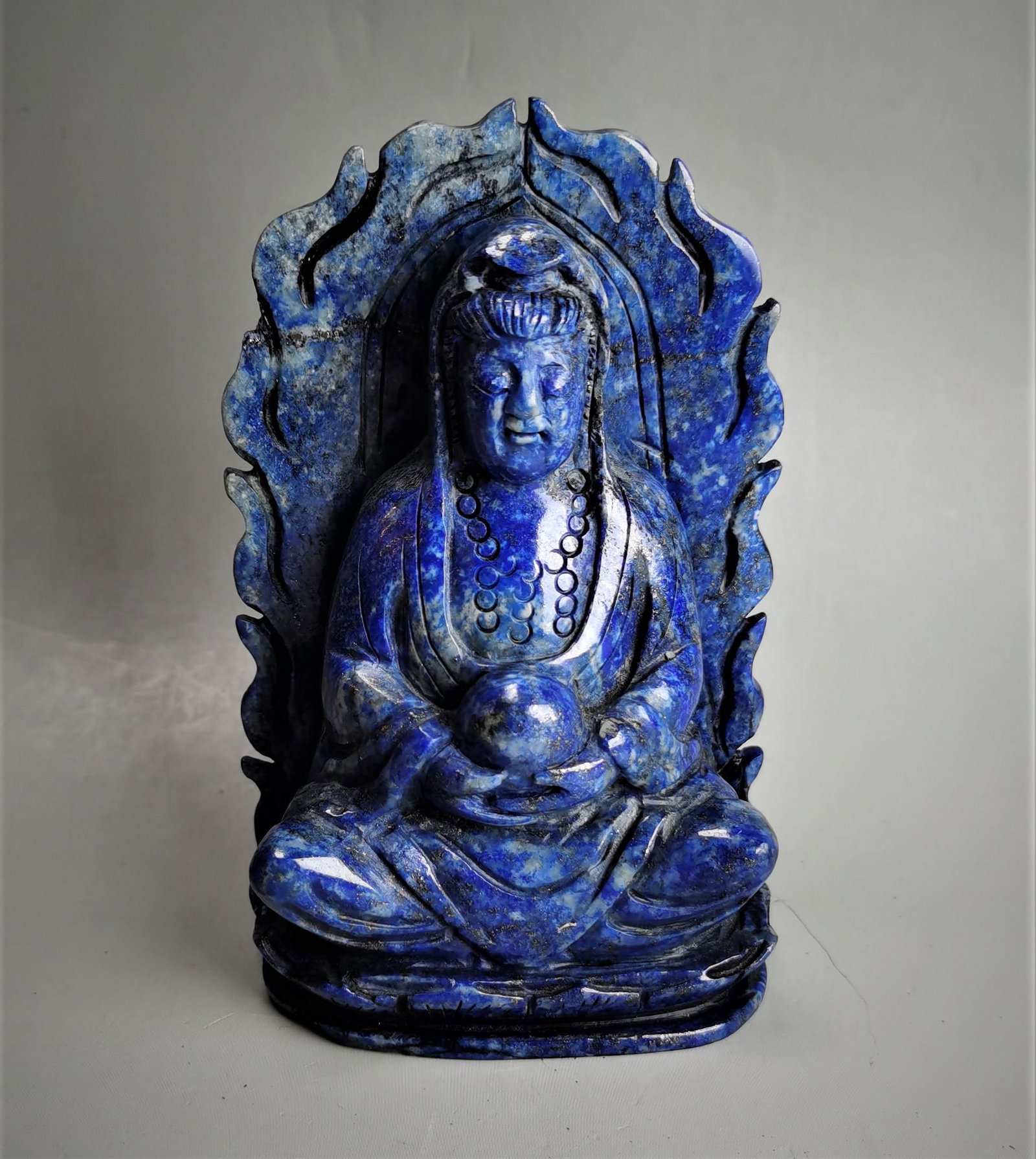 A Chinese lapis carved with Guanyin: A Chinese lapis carved with Guanyin, 12x7.5cm. Shipping: We are able to pack and ship this item to an address in the United States for $30.00 via USPS or UPS Ground. Tracking information will be sent 