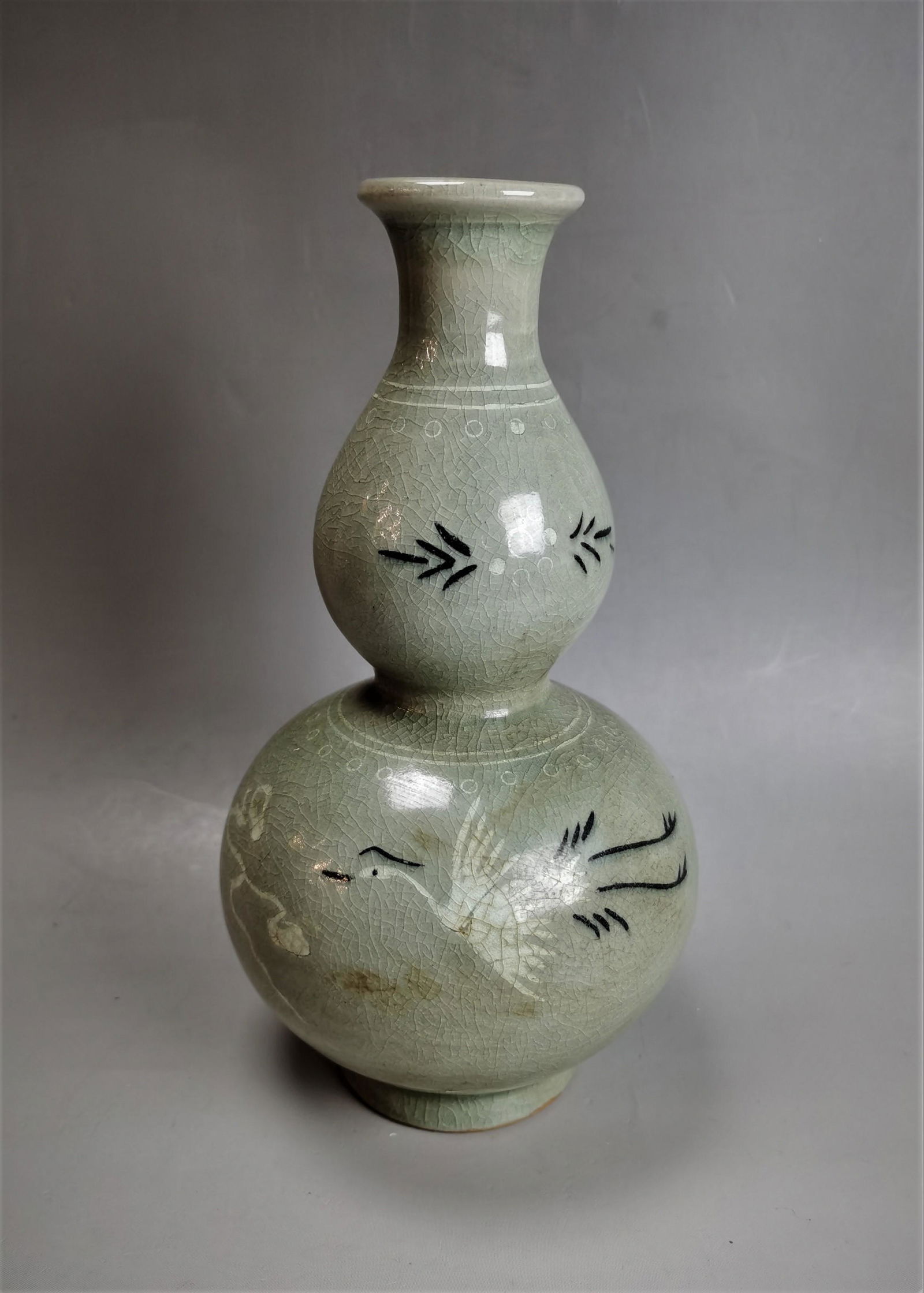 A Korean celadon porcelain vase: A Korean celadon porcelain vase H: 21.5cm Shipping: Buyer Pays Shipping Cost. Our gallery helps customers to arrange shipping via USPS. U.S. Bidders: Shipping quote will be included in your invoice; t