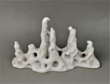 Chinese white porcelain caved mountain motif