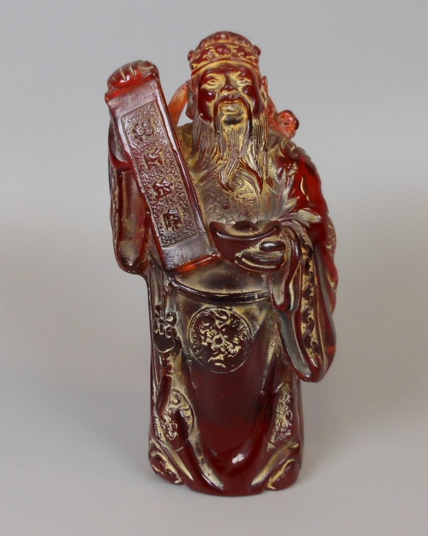 A Chinese carved amber figure (1 of 7)