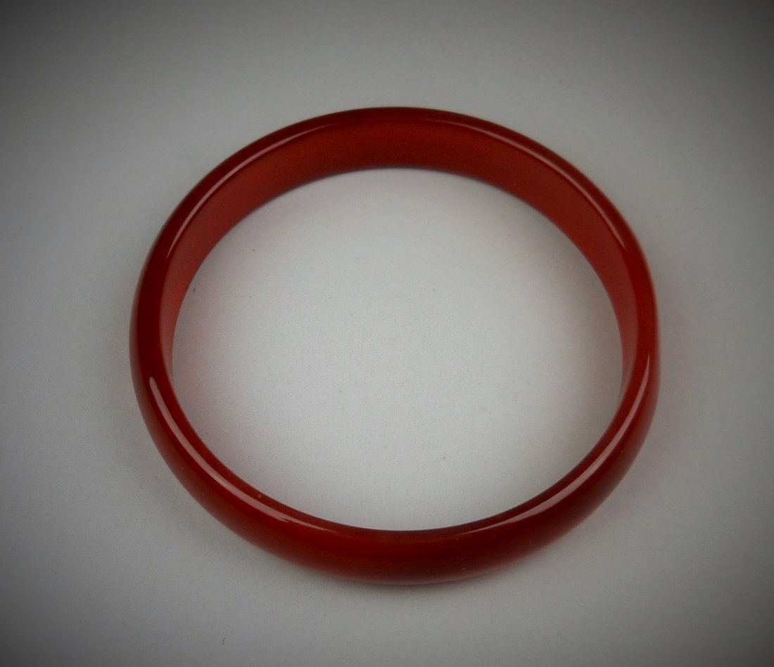 A Chinese red agate bangle (1 of 4)