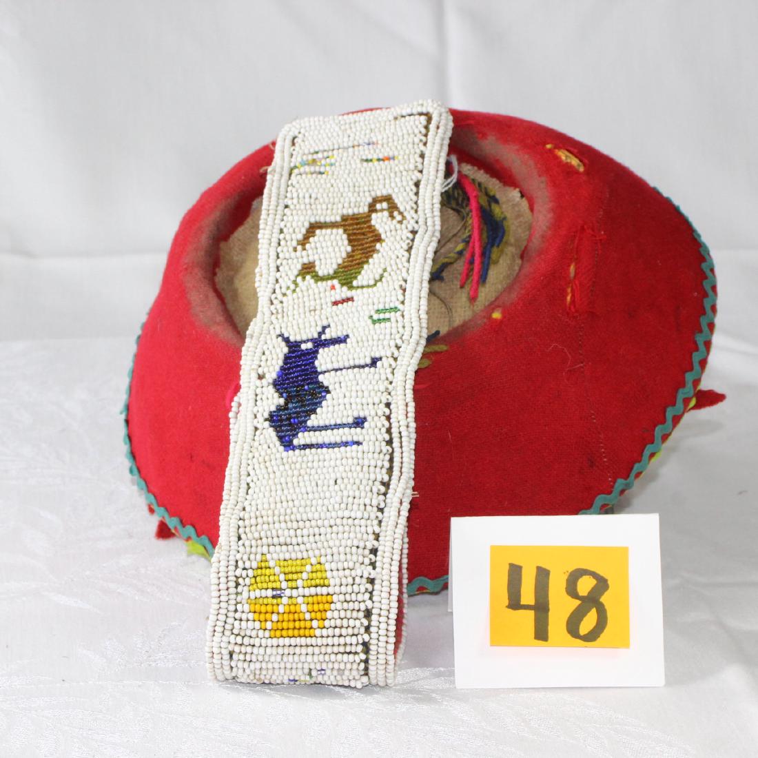 Traditional Peru Tribal Hat Montera Beaded Sanq'apa: Vintage traditional hat worn by Peruvian women, the strap (called a Sanq'apa) is heavily beaded â€“ the number of beads generally reflects the womans social status. 10"w x 11"l