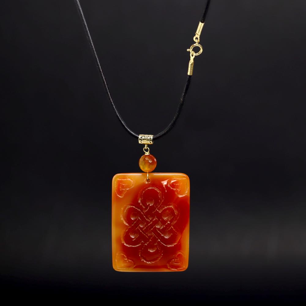 14K Gold & Carnelian Pendant: 14K Yellow Gold and carved Carnelian pendant necklace Length leather chain 16 inches Pendant is 2.5x1.5 inches