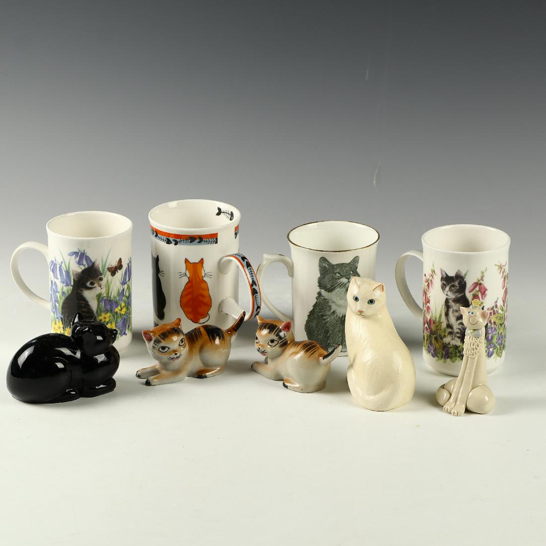 Five cat sculptures and four mugs: Five cat sculptures 2-3.5 inches and four mugs