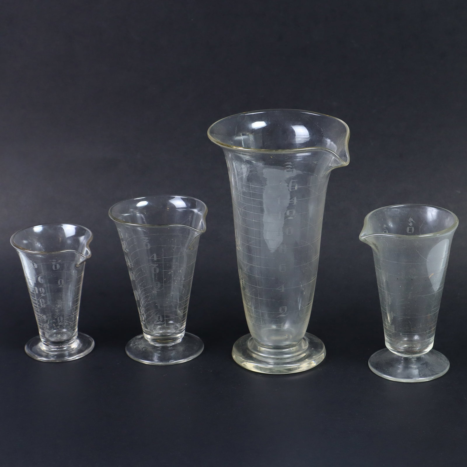 Antique Science Lab medical apothecary measuring glass beakers: Antique Science Lab medical apothecary measuring glass beakers 4,5,and 8 inches tall