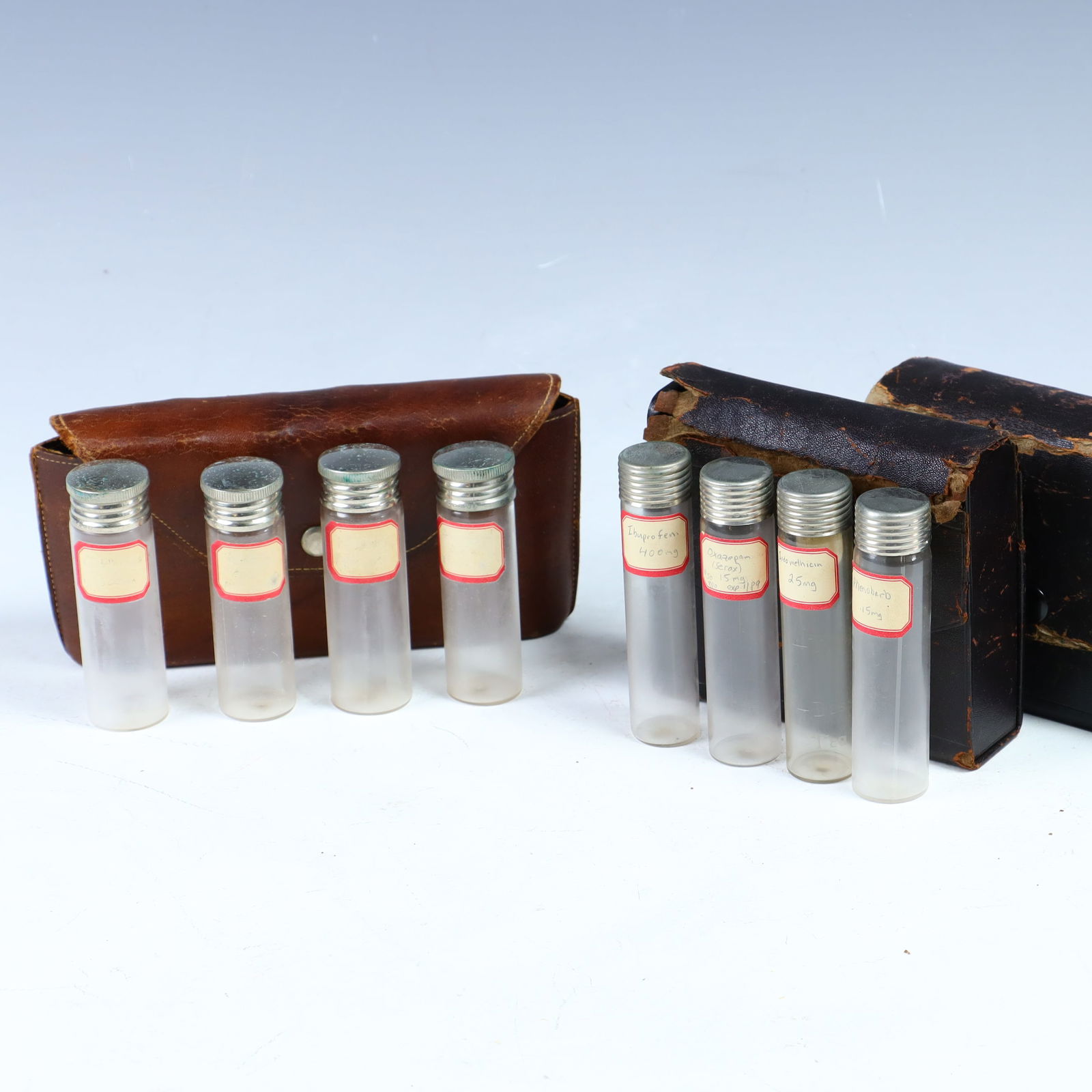 Antique medical bottles in leather cases (1 of 3)