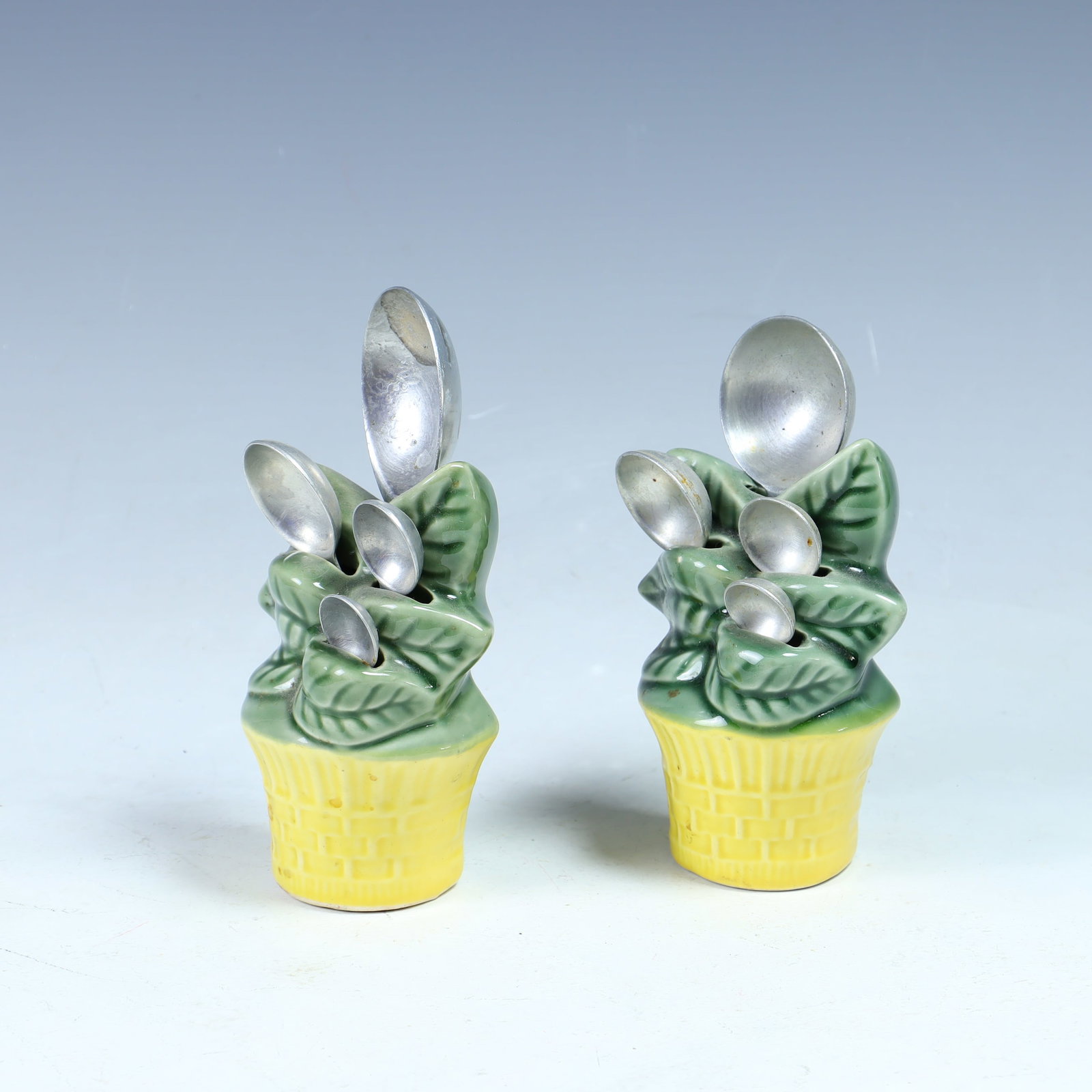 Two sets of vintage measuring spoons on ceramic tree holders (1 of 2)