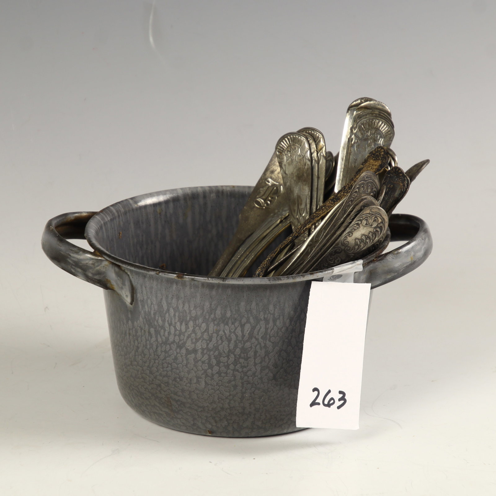 Lot of various vintage/antique spoons in an agate pot: Lot of various vintage/antique spoons in an agate pot 3 ¼ inches tall, 7.5 inches wide