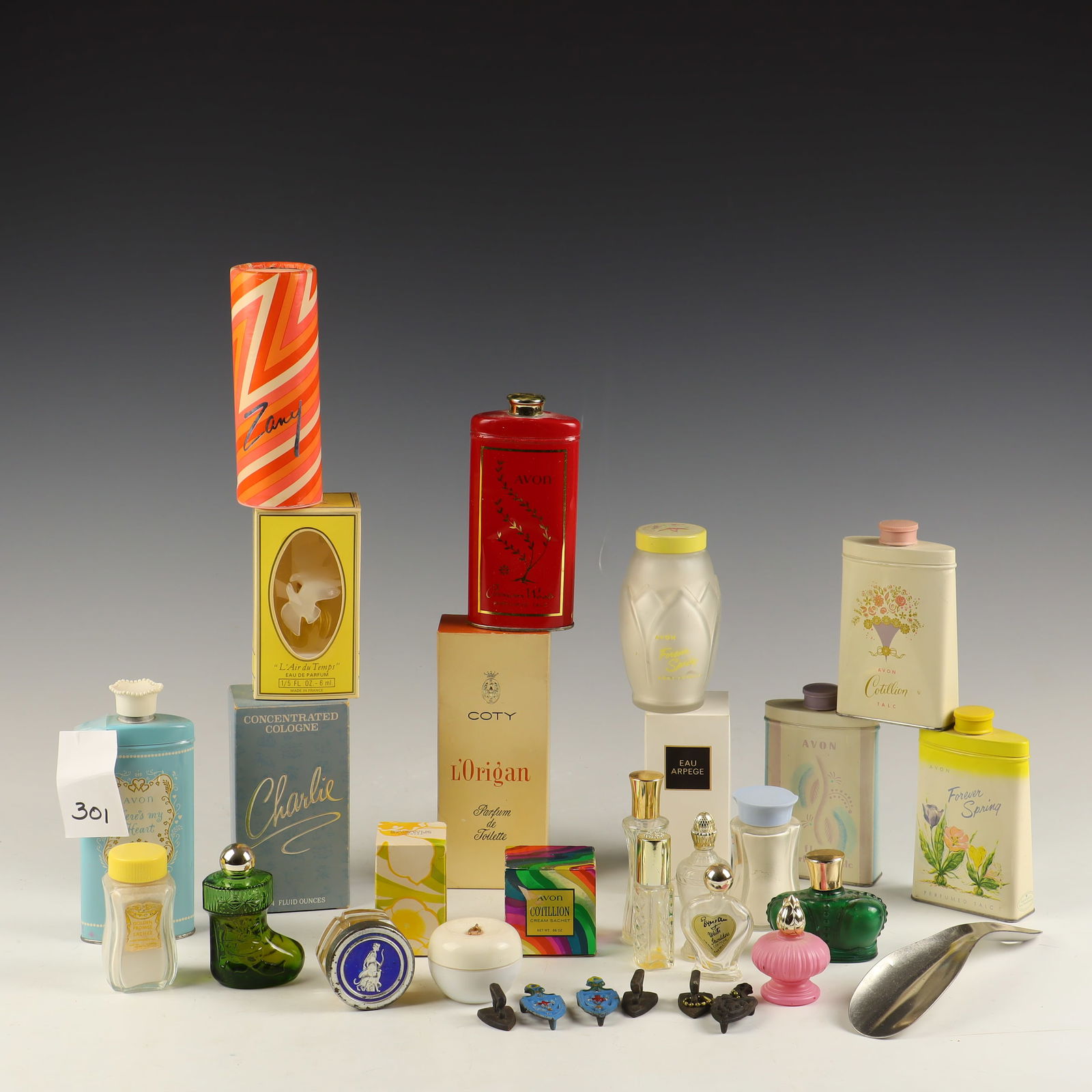 Lot of Perfume, cast iron mini trivets, and vintage advertising Powder: Lot of Perfume, cast iron mini trivets, and vintage advertising Powder