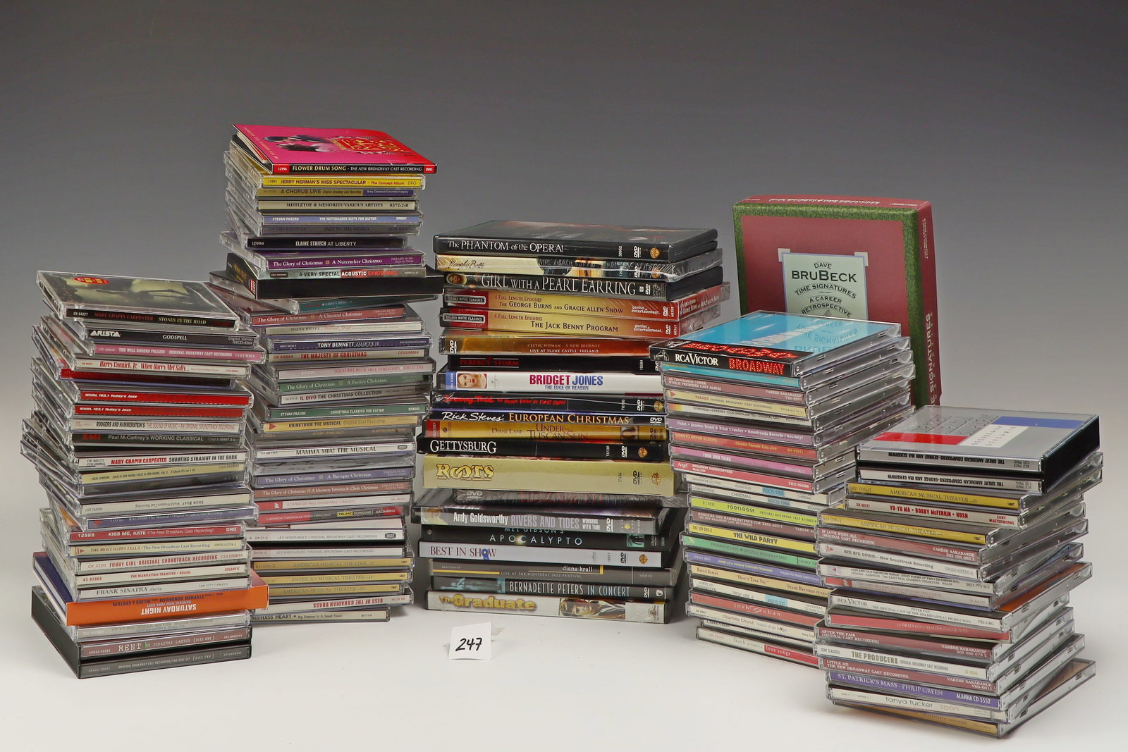 Lot of CDs, DVDs, and a rack: Lot of CDs, DVDs, and a rack