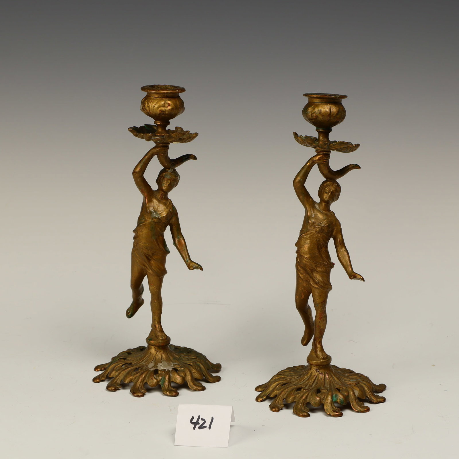 Bronze sculptures of male and female candlesticks: Bronze sculptures of male and female candlesticks 9 inches tall 4 inches base diameter