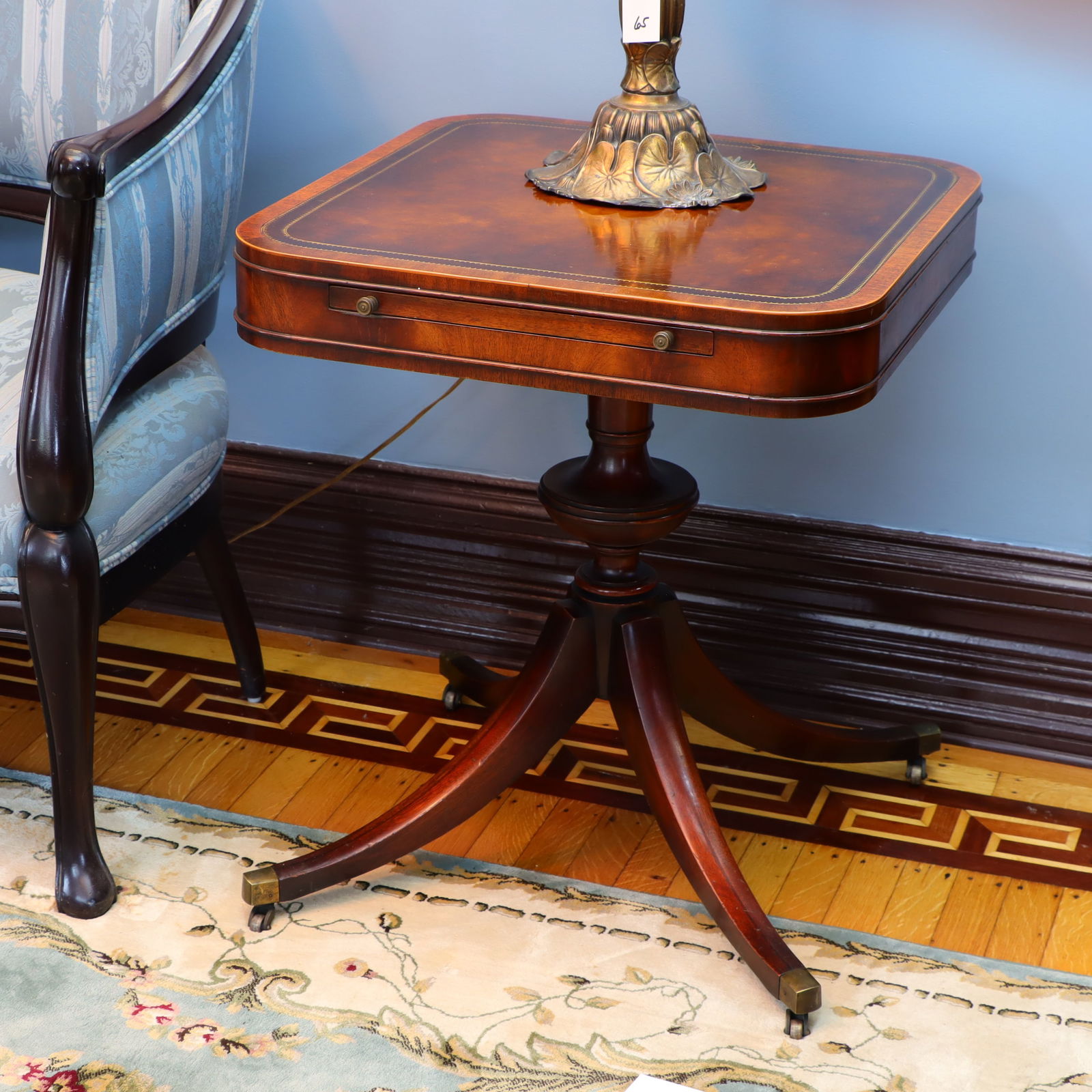 A pair of antique pedestal end tables (1 of 2)