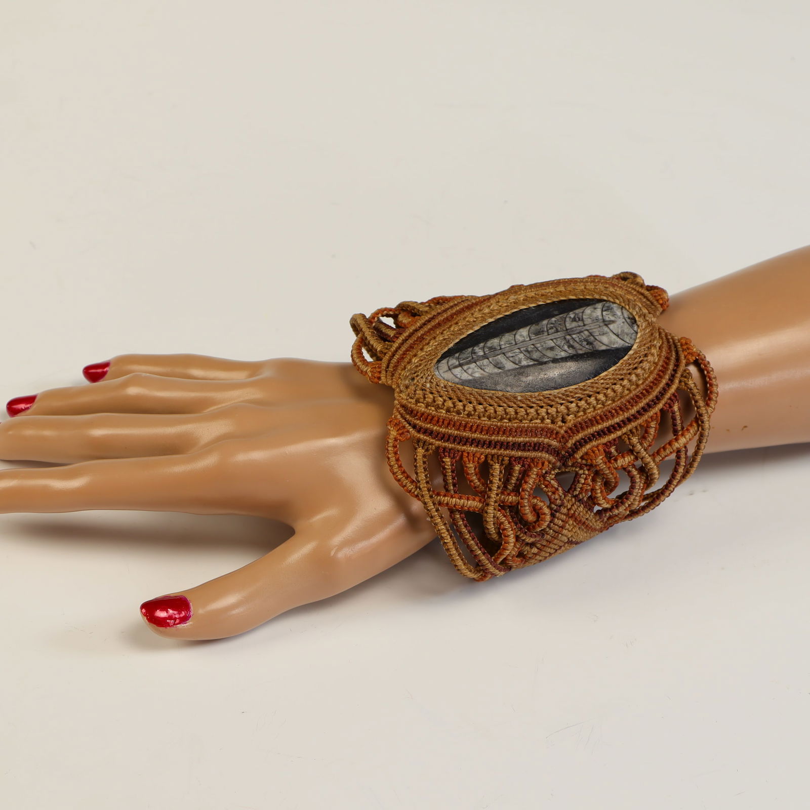 Macrame tribal cuff fossil stone bracelet: Macrame tribal cuff fossil stone bracelet 4 inches wide, adjustable length, excellent condition, made in Bahia Brazil