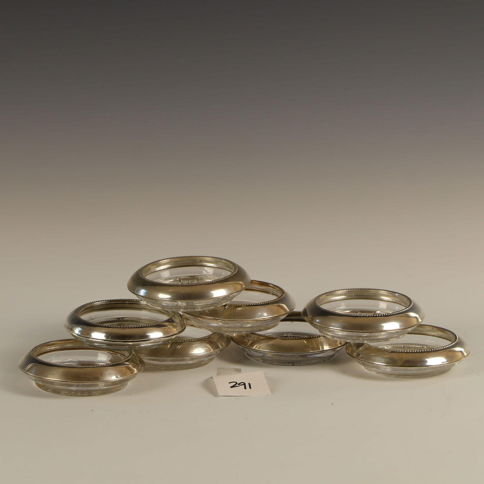 Eight Frank Whiting and Sons sterling silver rimmed glass coasters: Eight Frank Whiting and Sons sterling silver rimmed glass coasters 4 inches diameter