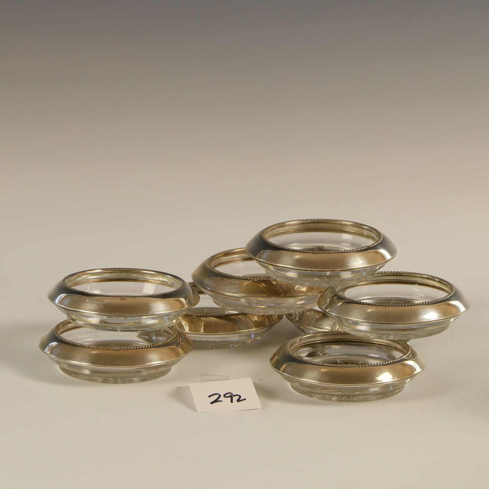 Eight Frank Whiting and Sons sterling silver rimmed glass coasters: Eight Frank Whiting and Sons sterling silver rimmed glass coasters 4 inches diameter