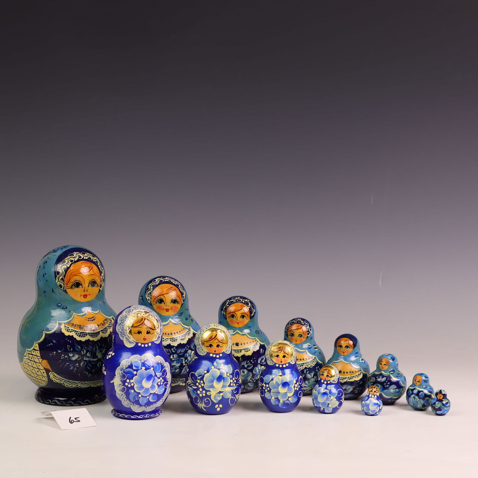 Two Vintage Matryoshka Dolls One Signed: Signed KBH Poccua #10 wooden nesting dolls 7 inches tall and one unsigned 5 inches tall