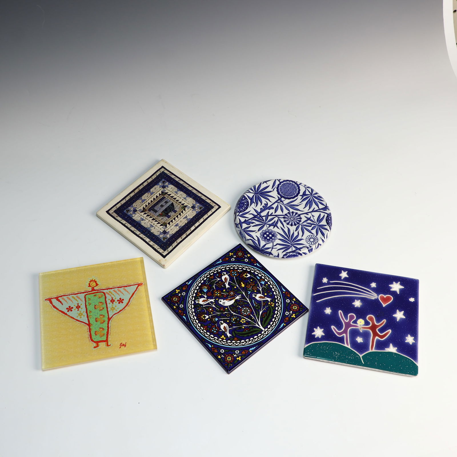 Five vintage Trivets: Five vintage Trivets, one is Servv made in West Bank 6X6 inches, 1 glass by Art and Tile of Santa Fe