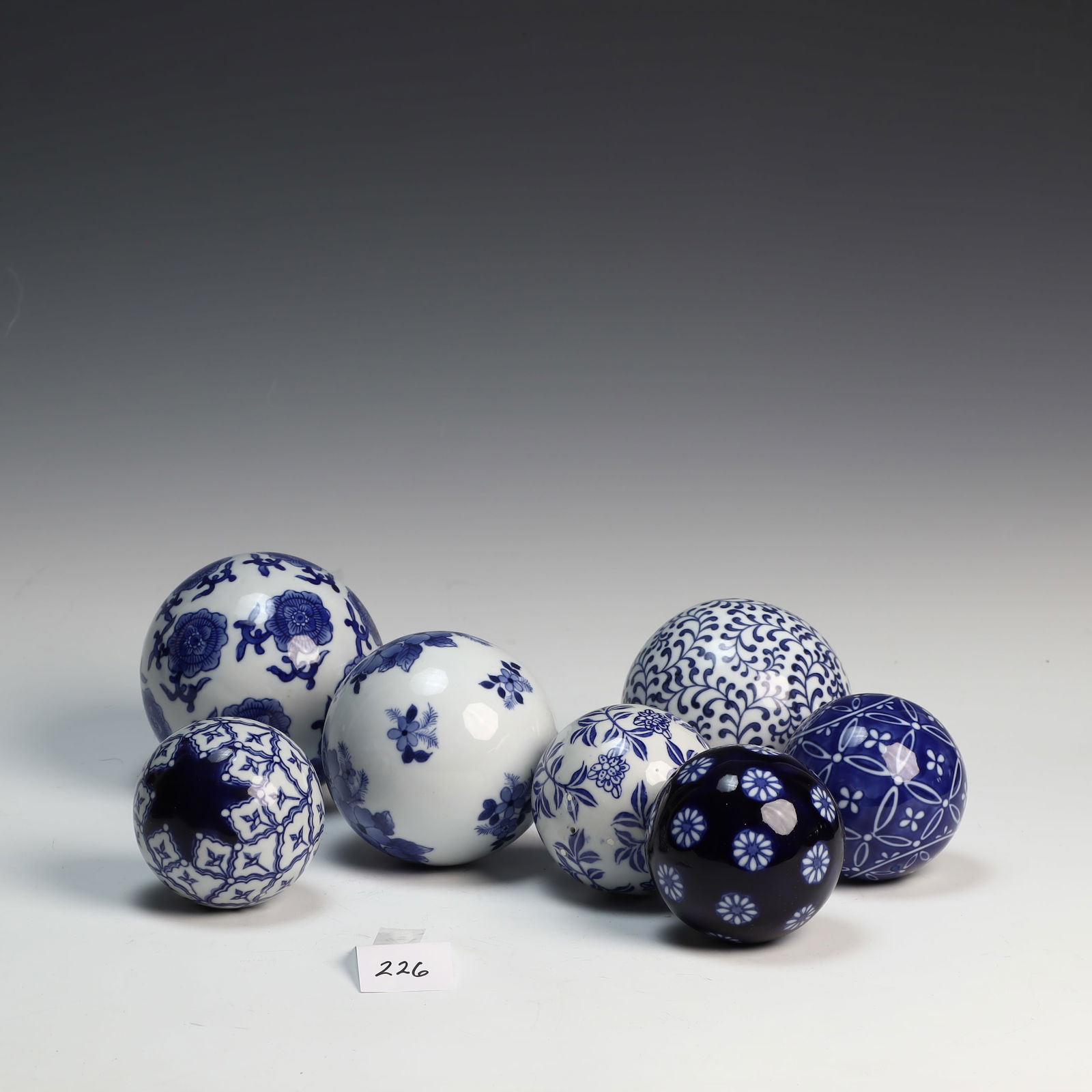 Seven blue and white floral Asian decorative balls (1 of 2)
