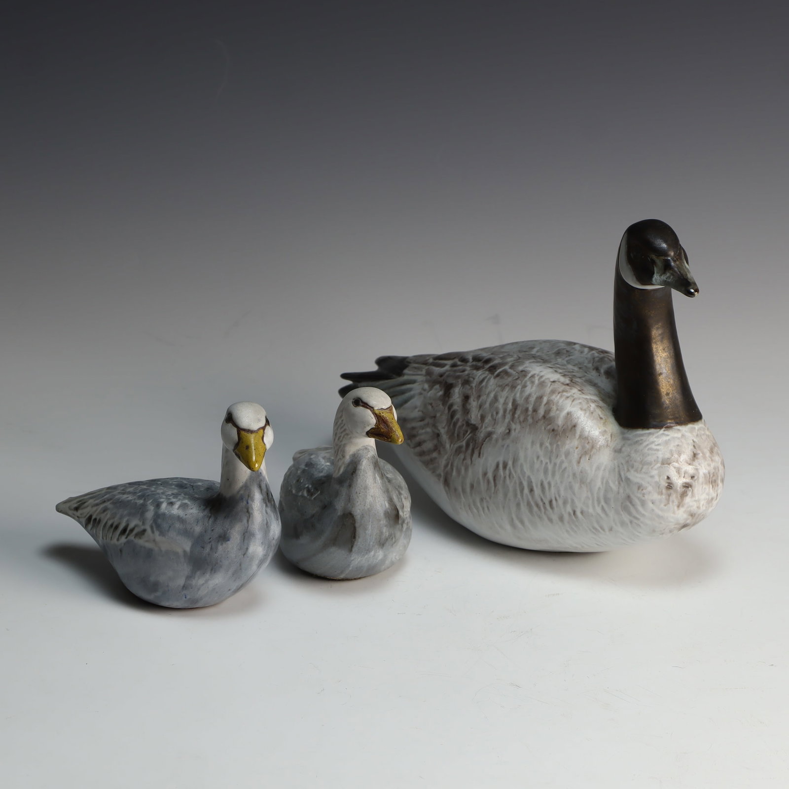 Three Vintage Andersen Design stoneware Duck Sculptures: Three Vintage Andersen Design stoneware Duck Sculptures, East Boothbay, Maine, sizes are 12X4X7 inches, 6.5X3X4 ¾ inches tall