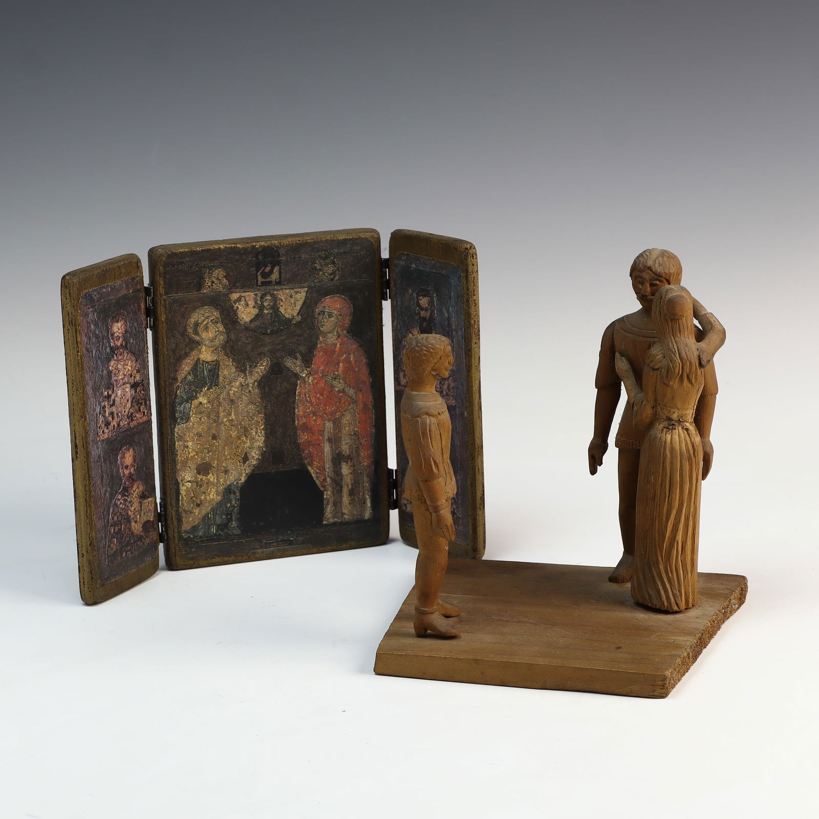 Primitive wooden family statue and a religious wooden icons (1 of 3)