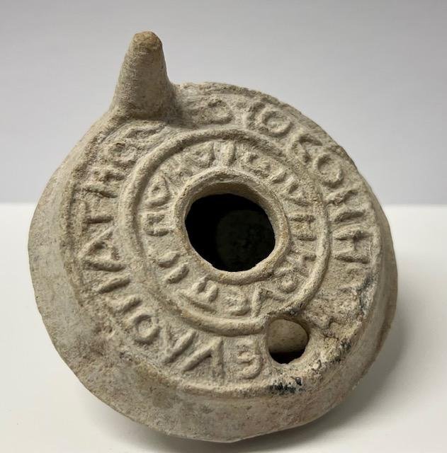 Rare Byzantine Holy Land Christian Lamp.: Rare Byzantine Holy Land Christian Lamp, Ancient terracotta oil lamp, Ca 5th century AD, inscribed in relief Greek letters with two circular lines of text, Intact. Size : 9 cm x 4 cm Ex private Sunris