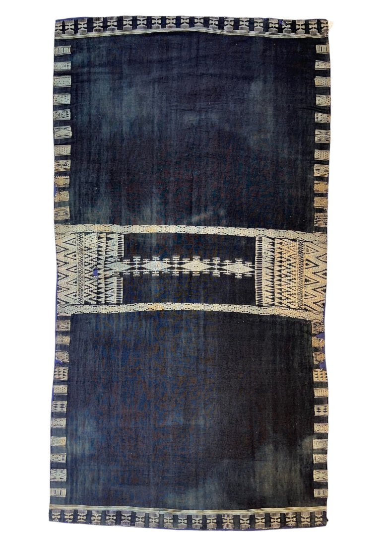 A Very Fine And Rare Tunisian Indigo Woman's Realm Bakhnoug (head and shoulders Mantle): Very rare and extremely fine Tunisian Indigo Woman's â€˜Realm Bakhnougâ€™ (worn draped over the head and shoulders as a mantle). Late 19th Century. This finely woven piece, featuring intricat