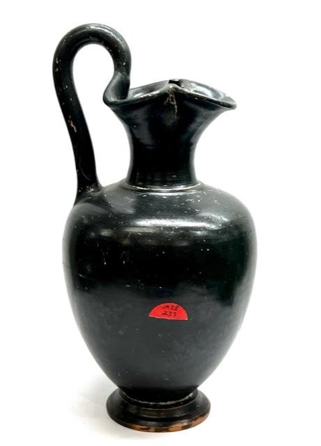 Ancient Etruscan Bucchero Oinochoe pitcher.: Beautiful Etruscan Bucchero Oinochoe, ca. 5th century BCE , Fine pottery wine pitcher (Oinochoe) in bucchero ware. Round body on short flared foot, long thin neck sweeping outwear to pinched spout. in