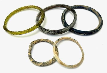 Group Of 5 Roman Glass Bracelets.: Group Of 5 Roman Glass Bracelets, 1st to 3rd century AD, beautiful color and iridescence patina. Size: 7.5 cm to 5 cm diameter Ex private NY collection.