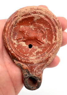 Ancient Roman Red Clay Oil Lamp with Lion c.200 AD: Ancient Roman Red Clay Oil Lamp with Dolphin c.200 AD-400AD , size : 9 cm x 6 cm Provenance: Ex private NY collection.