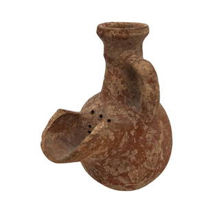 Ancient Holy Land Pottery Spouted Strainer Jug: Holy Land Pottery Spouted Strainer Jug, Hebron, Iron Age, ca. 800 BCE.Rarely a vessel intended not only to contain a liquid, but also to filter it. The jug was wheel turned, while the handle and the s