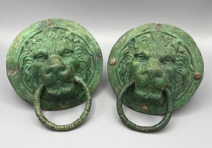 A Pair of Roman Bronze Lion-Headed Handles