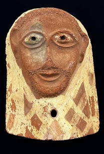 Egyptian Nubian terracotta sarcophagus mask.: Egyptian Ptolemaic Nubian painted terracotta sarcophagus mask. With prominent facial details. Circa @ 300 B.C. Mounted. 16 X 13 inches. with frame, 26 inches X 21 inches . Provenance: Ex Ye Olde Curio
