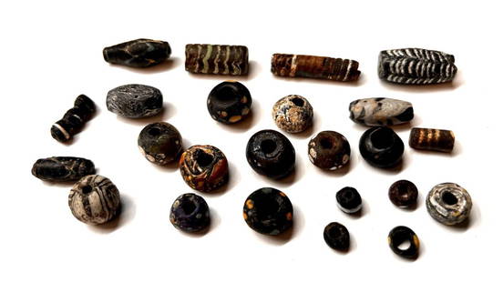 A mixed group of assorted Roman glass mosaic beads: Group of assorted Roman glass mosaic beads, circa: 1st - 4th Century AD, of various colors, a couple are of mosaic glass.Size:3.5 cm - 0.8cm approximately. Ex NJ private collection.