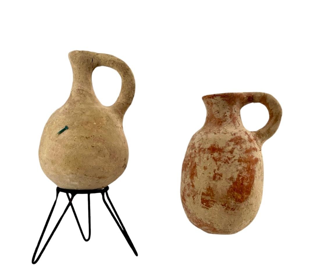 2 Ancient Holy Land, Old Testament Period juglet.: 2 Holy Land near eastern Old Testament Period, c. 1000 - 600 BC. Biblical period ,Cute little ware juglet, with rounded body and single handle Size : 11cm - 11.5 cm with out the base Provenance: NJ Dr