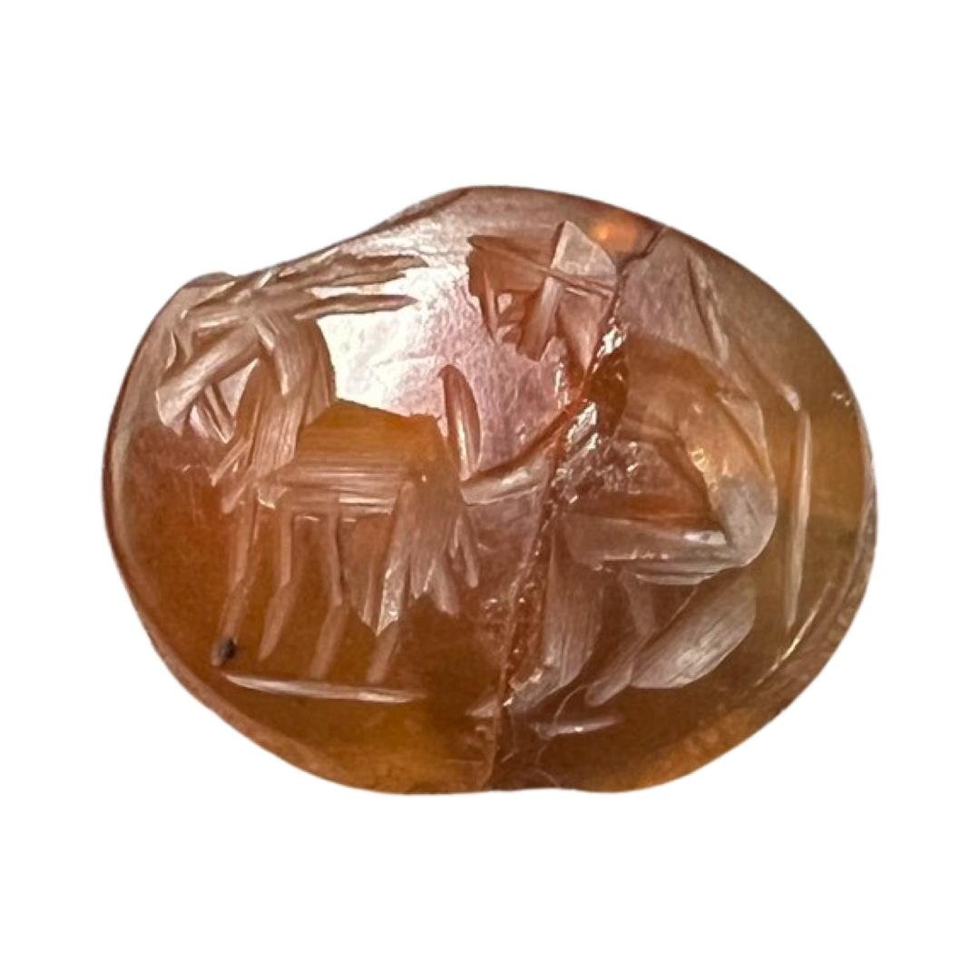 Roman Cornelian Intaglio: Roman Cornelian Intaglio, circa: Roman, 1st-2nd Century A.D. with engraved animal and figures. Size: 1.5cm Ex Private NYC collection