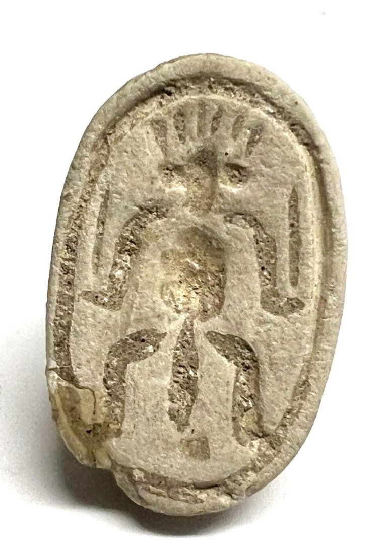 An Egyptian steatite scarab, Late Period. (1 of 2)