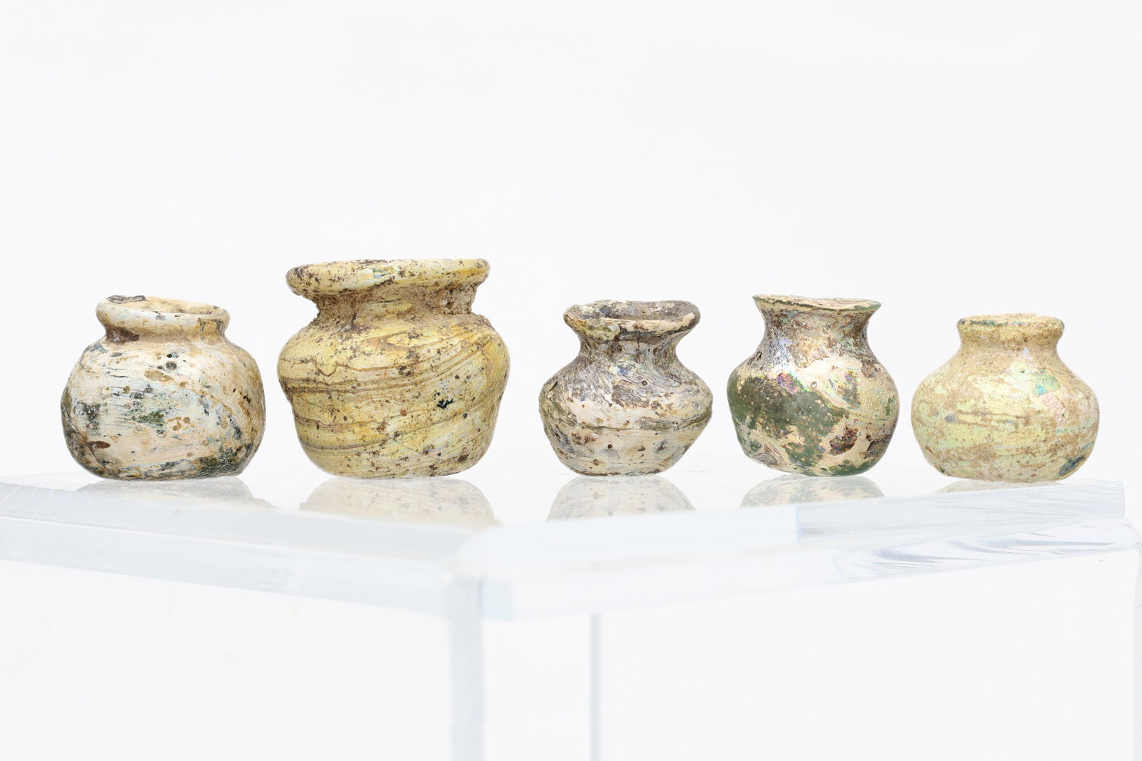 Group of 5 Roman glass Miniature Jar,: Group of 5 Roman glass Miniature Jar,1st-3rd century A.D, each with nice iridescence patina. Size:3cm - 2 cm, Provenance: Ex private NY collection.
