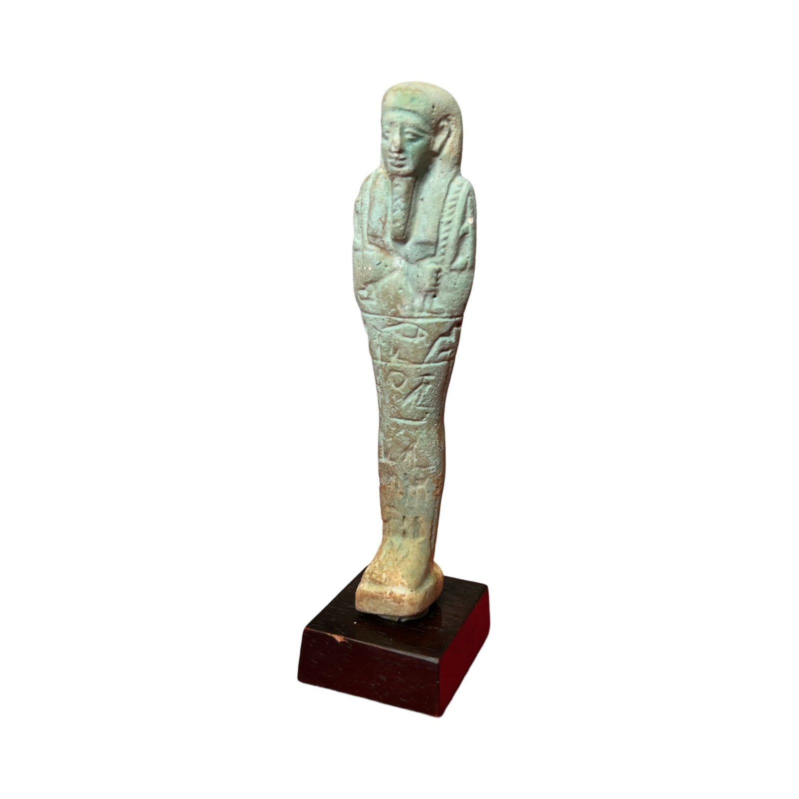 Ancient Egyptian Faience Ushabti.: Ancient Egyptian Faience Ushabti, Late Period c.550-300 BC standing on a tripartite base and depicted mummiform, wearing a tripartite wig with false beard, arms folded over chest, hands holding a pick