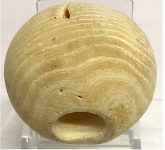 Egyptian Naqada III Banded Alabaster Mace Head.: An Egyptian Pre-Dynastic Serpentine Mace-Head, ca 3500-3200 BC,the heavy spherical form pierced longitudinally for attachment to a wooden shaft, the exterior polished to a smooth finish. Provenance: