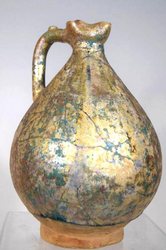 Islamic persian Nishapur Ceramic Pitcher: Islamic Nishapur Ceramic Pitcher,11th century Persian Islamic Nishapur Ceramic Pitcher Turquoise with luster . Finely hand painted . Condition : repaired Size : 19 cm x 13 cmProvenance: Ex-collection 