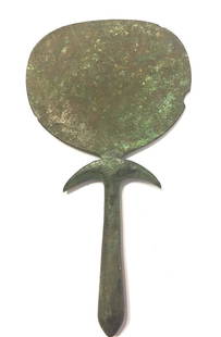 Ancient Egyptian bronze mirror .: Ancient Egyptian bronze mirror, Late Period, c. 600 - 400 BC, the handle in the form of a papyrus column, the Base with curled edges, nice green patina with, Provenance :Ex Israel collector Menachem W