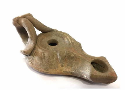 Ancient Roman oil Lamp with unique handle.: Ancient Roman oil Lamp with unique handle, 100 AD-300 AD , nice decoration and patina, intact . Size : 12 cm x 5cm , Provenance: Ex- John Hibner, acquired in Turkey during military service 1960's