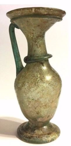 Ancient Roman Glass Jug: Ancient Roman Glass Amphora Jug , Circa : 1st - 3rd century AD ,Beautiful Green color , Intact .Provenance: Ex Leslie, Michigan, private Collection , Size : 12 cm x 4.5 cm