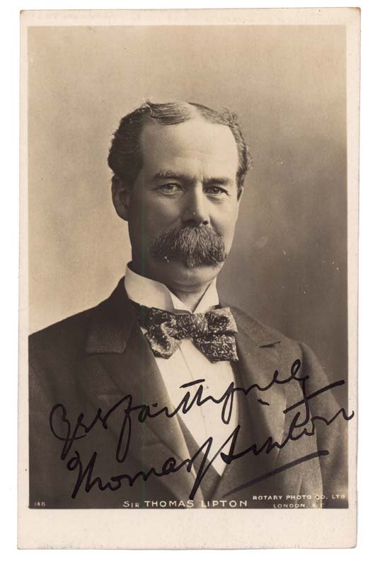 THOMAS LIPTON SIGNED PHOTO POSTCARD: SIR THOMAS LIPTON (1850 -1931) Scottish merchant and yachtsman who created the famous Lipton tea brand. 3 1/4" x 5 1/4" Picture Postcard of Lipton inscribed, "Very Faithfully Thomas J. Lipton" Mountin